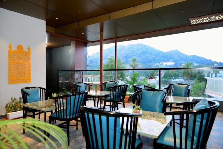Rooftop restaurant at Crystal Inn Mount Abu with mountain view and fine dining experience